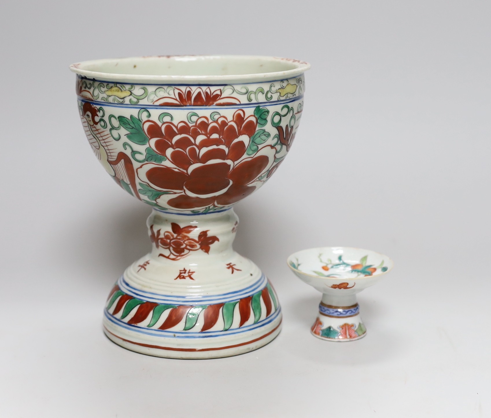 A small 19th Chinese stem dish decorated with peaches and a late 20th century large Wucai stem cup, 18.5cm